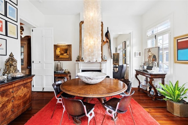 927 Dauphine St, New Orleans, LA 70116 - dining room with hardwood / wood-style flooring and a fireplace