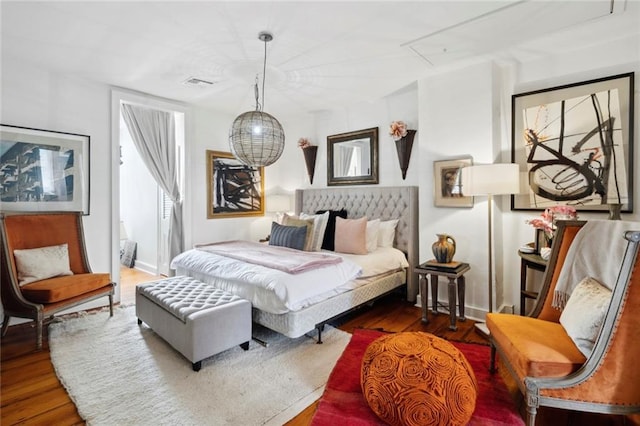 927 Dauphine St, New Orleans, LA 70116 - bedroom with wood finished floors