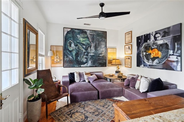 927 Dauphine St, New Orleans, LA 70116 - living room featuring a ceiling fan and wood finished floors