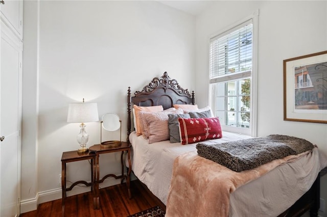 927 Dauphine St, New Orleans, LA 70116 - bedroom featuring wood finished floors and baseboards