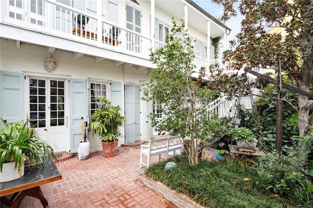 927 Dauphine St, New Orleans, LA 70116 - view of exterior entry featuring a balcony and a patio area