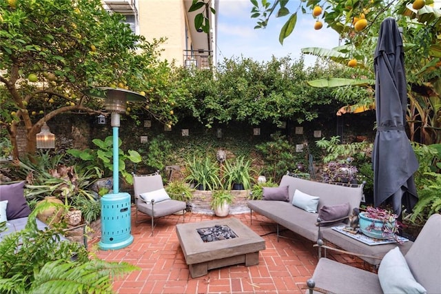 927 Dauphine St, New Orleans, LA 70116 - view of patio / terrace with an outdoor living space with a fire pit