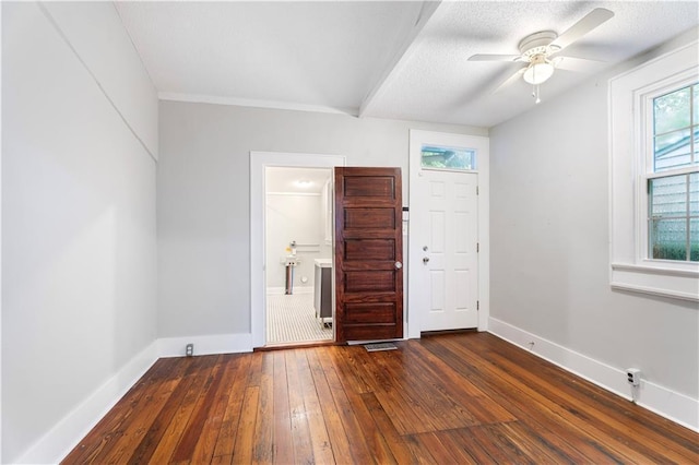 82729 Mazant St, New Orleans, LA 70117 - spare room featuring dark wood finished floors, ceiling fan, and baseboards
