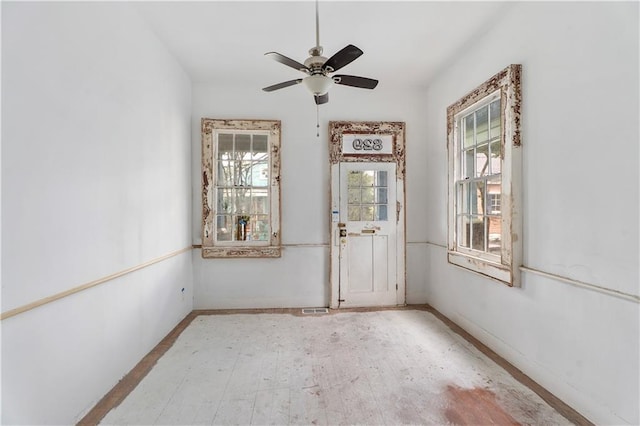 82729 Mazant St, New Orleans, LA 70117 - unfurnished room with baseboards, a ceiling fan, and light wood-style flooring