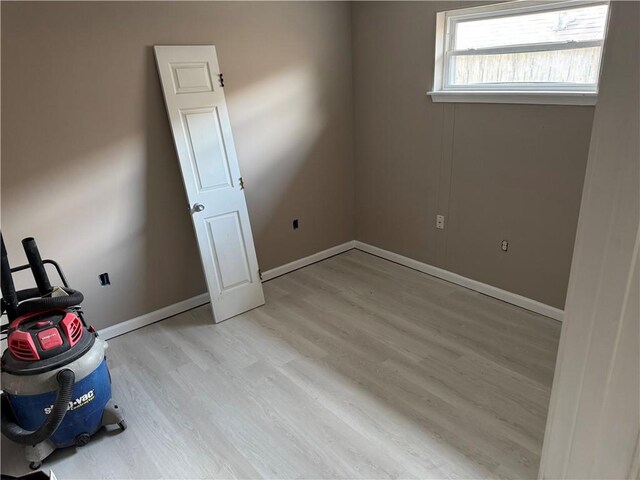 7916 Unity Dr, New Orleans, LA 70128 - empty room featuring light wood-style floors and baseboards
