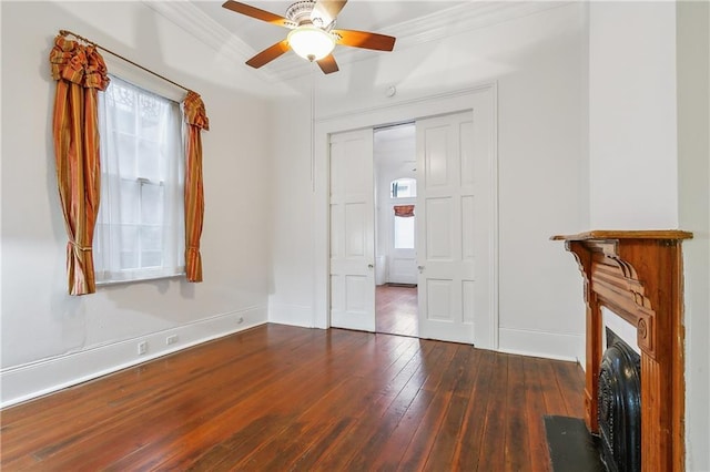 820 St Ann St Unit A, New Orleans, LA 70116 - unfurnished bedroom with hardwood / wood-style flooring, ornamental molding, baseboards, a fireplace with flush hearth, and ceiling fan
