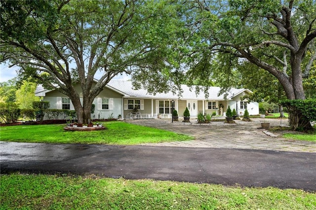 581 S Military Rd, Slidell, LA 70461 - ranch-style home featuring a porch and a front yard