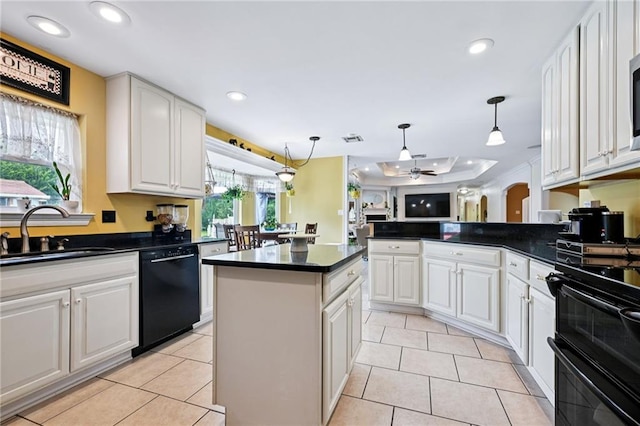 581 S Military Rd, Slidell, LA 70461 - kitchen featuring a sink, black dishwasher, dark countertops, recessed lighting, and white cabinets