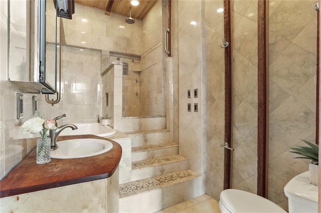 4716 Annunciation St Unit 3A, New Orleans, LA 70115 - bathroom featuring a tile shower, vanity, tile walls, tile patterned flooring, and wood ceiling