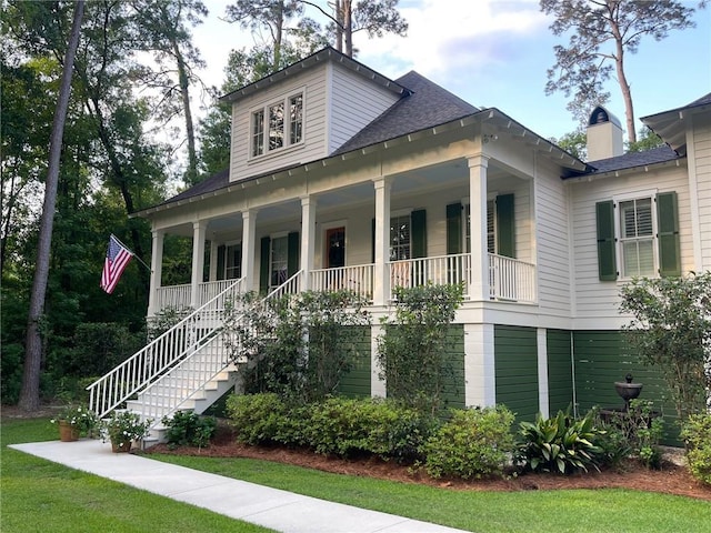 607 E 3rd Ave, Covington, LA 70433 - view of front of house with a porch, stairs, and a shingled roof