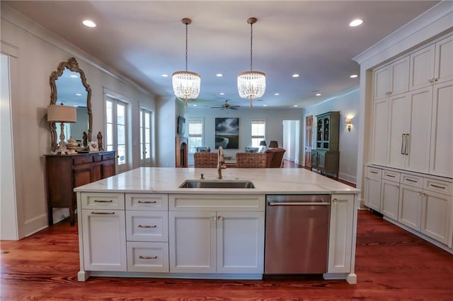 607 E 3rd Ave, Covington, LA 70433 - kitchen featuring stainless steel dishwasher, a sink, a chandelier, light stone counters, and recessed lighting