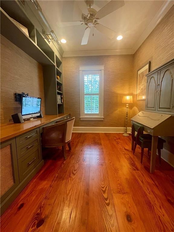 607 E 3rd Ave, Covington, LA 70433 - office area with built in desk, baseboards, a ceiling fan, dark wood finished floors, and crown molding