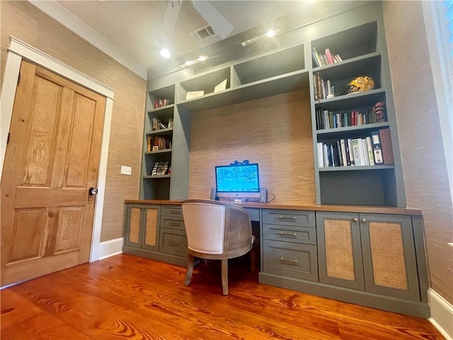 607 E 3rd Ave, Covington, LA 70433 - office with built in desk, wood finished floors, baseboards, and built in shelves