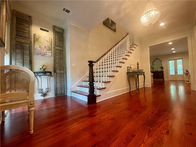 607 E 3rd Ave, Covington, LA 70433 - entrance foyer with wood finished floors, stairs, baseboards, a chandelier, and recessed lighting