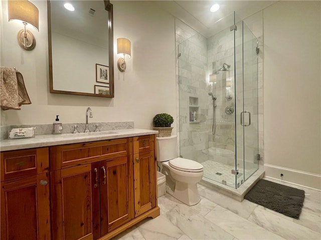 607 E 3rd Ave, Covington, LA 70433 - full bath featuring toilet, vanity, marble finish flooring, a stall shower, and recessed lighting