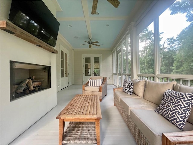 607 E 3rd Ave, Covington, LA 70433 - sunroom featuring french doors, a ceiling fan, an outdoor living space with a fireplace, and coffered ceiling