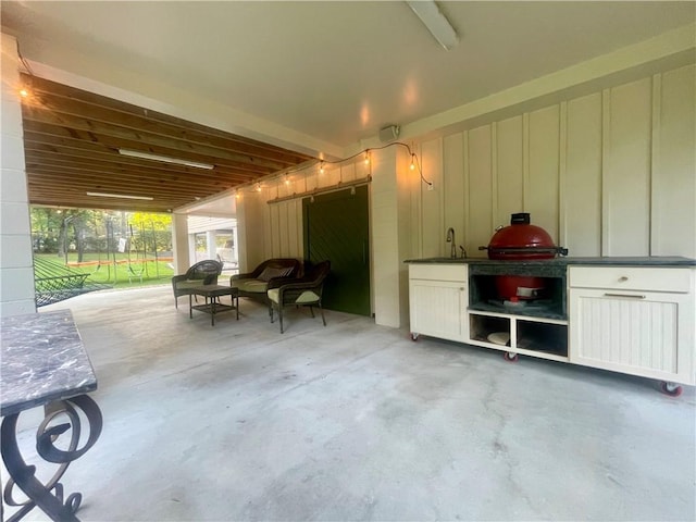 607 E 3rd Ave, Covington, LA 70433 - view of patio with a sink
