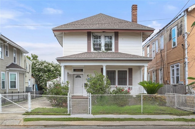 2031 General Taylor St, New Orleans, LA 70115 - traditional style home with covered porch, a gate, roof with shingles, a chimney, and a fenced front yard