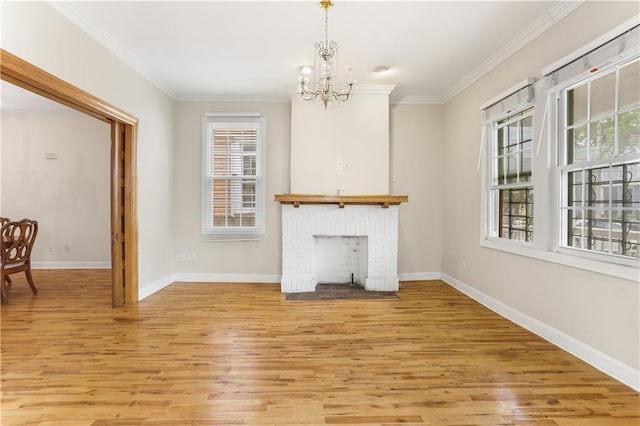 2031 General Taylor St, New Orleans, LA 70115 - unfurnished living room featuring a chandelier, light wood-style floors, ornamental molding, baseboards, and a fireplace