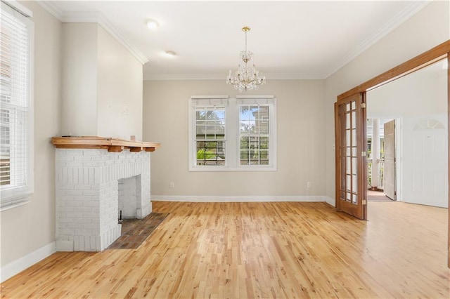 2031 General Taylor St, New Orleans, LA 70115 - unfurnished living room featuring wood finished floors, a chandelier, baseboards, crown molding, and a brick fireplace