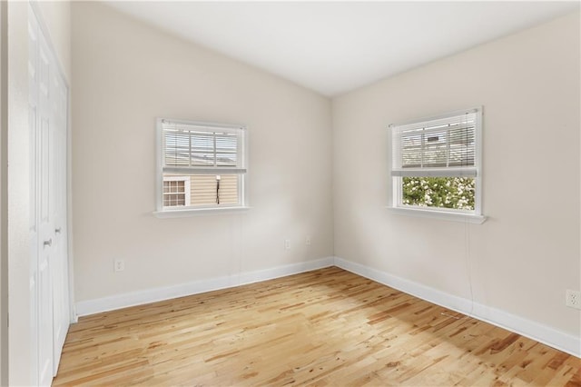 2031 General Taylor St, New Orleans, LA 70115 - empty room with plenty of natural light, wood finished floors, and baseboards
