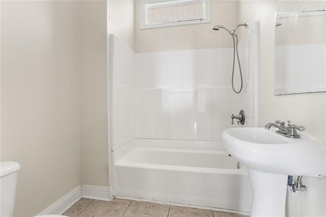 2031 General Taylor St, New Orleans, LA 70115 - full bath featuring tile patterned flooring, toilet, shower / bath combination, and baseboards