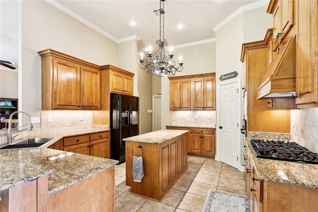 1132 Scarlet Oak Ln, Mandeville, LA 70448 - kitchen featuring black appliances, a sink, decorative backsplash, light stone countertops, and ornamental molding