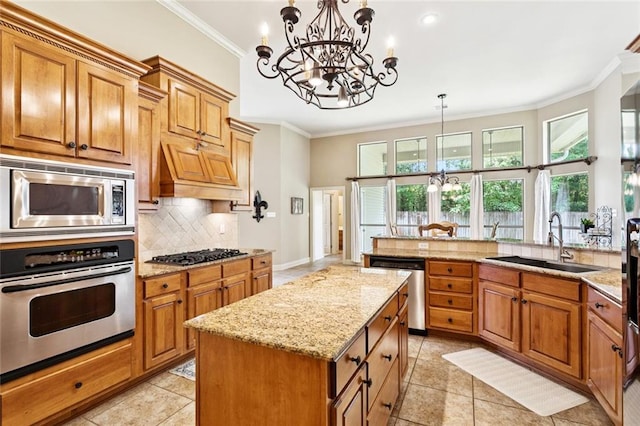 1132 Scarlet Oak Ln, Mandeville, LA 70448 - kitchen with appliances with stainless steel finishes, a sink, crown molding, a chandelier, and backsplash