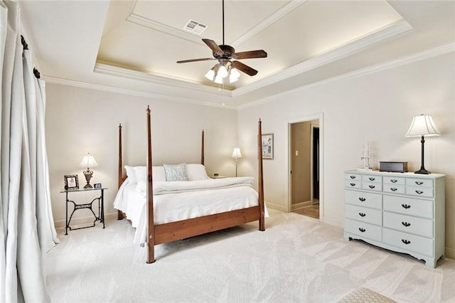 1132 Scarlet Oak Ln, Mandeville, LA 70448 - bedroom with a tray ceiling, ornamental molding, light colored carpet, a ceiling fan, and baseboards