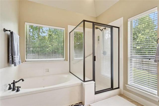 1132 Scarlet Oak Ln, Mandeville, LA 70448 - full bathroom featuring a shower stall, a garden tub, and plenty of natural light
