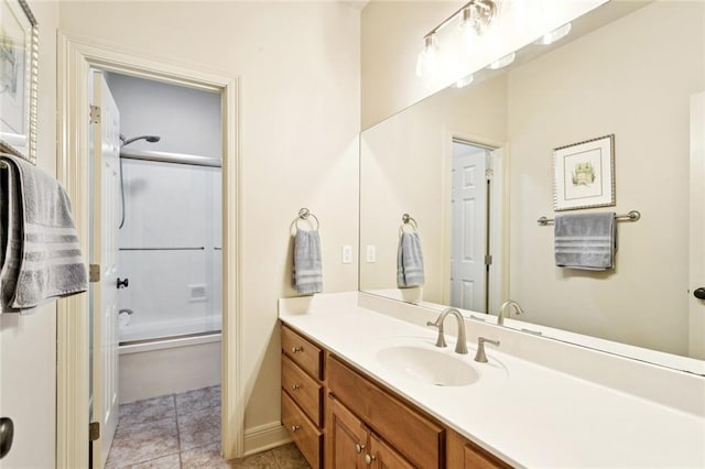 1132 Scarlet Oak Ln, Mandeville, LA 70448 - bathroom with vanity, bath / shower combo with glass door, tile patterned floors, and baseboards