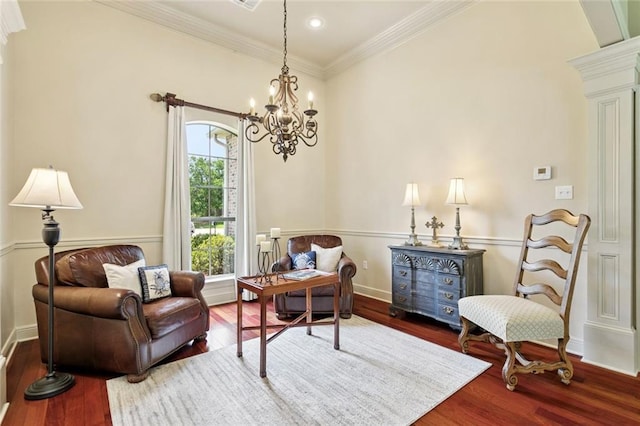 1132 Scarlet Oak Ln, Mandeville, LA 70448 - living area featuring wood finished floors, a chandelier, ornamental molding, and baseboards