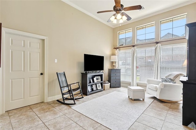 1132 Scarlet Oak Ln, Mandeville, LA 70448 - living area featuring ornamental molding, light tile patterned floors, ceiling fan, a towering ceiling, and baseboards