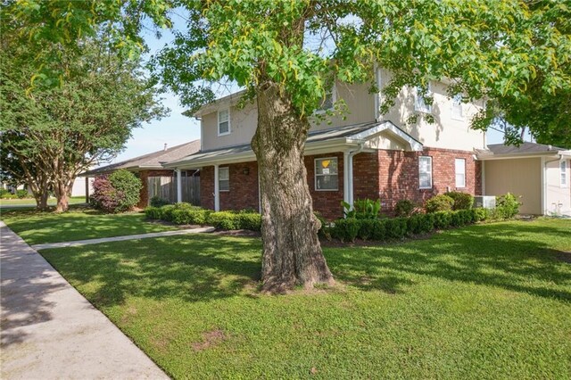 200 Pike Dr, Gretna, LA 70053 - view of front of house featuring a front lawn and brick siding