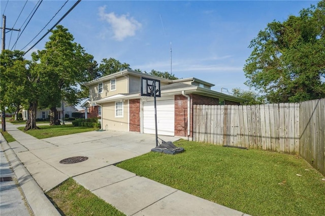 200 Pike Dr, Gretna, LA 70053 - view of home's exterior featuring brick siding, concrete driveway, and an attached garage