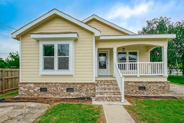 70 Old Hickory St, Chalmette, LA 70043 - view of front of home with covered porch and crawl space