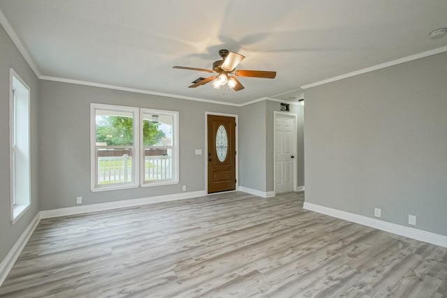 70 Old Hickory St, Chalmette, LA 70043 - entrance foyer featuring ceiling fan, crown molding, light wood finished floors, and baseboards