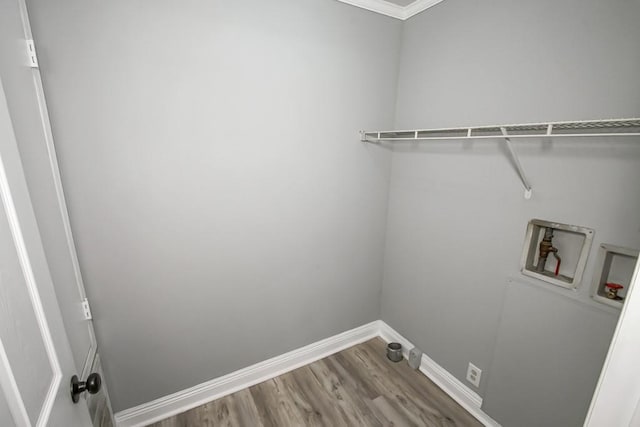 70 Old Hickory St, Chalmette, LA 70043 - washroom featuring hookup for a washing machine, wood finished floors, and baseboards