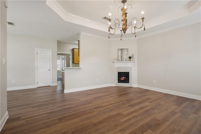 112 Short St Unit A, Slidell, LA 70461 - unfurnished living room with a tray ceiling, a chandelier, dark wood-style floors, a tile fireplace, and crown molding