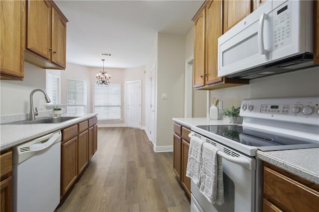 112 Short St Unit A, Slidell, LA 70461 - kitchen featuring white appliances, a sink, wood finished floors, and brown cabinets