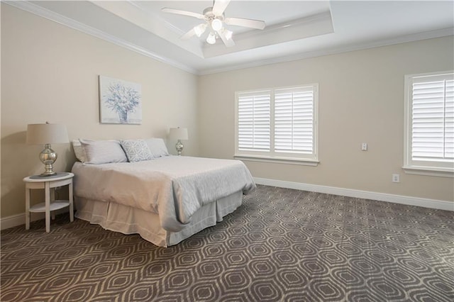 112 Short St Unit A, Slidell, LA 70461 - bedroom with ornamental molding, dark carpet, baseboards, a raised ceiling, and a ceiling fan