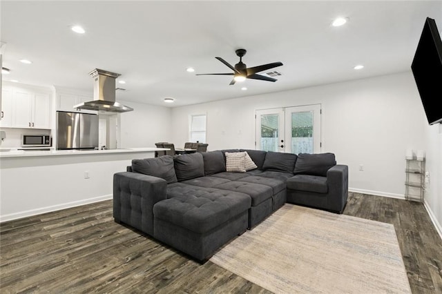 6200 Leslie St, Metairie, LA 70003 - living room featuring dark wood-type flooring, recessed lighting, ceiling fan, baseboards, and french doors