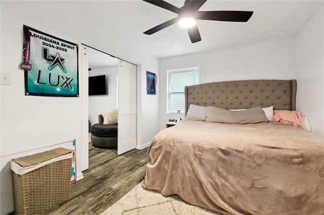 6200 Leslie St, Metairie, LA 70003 - bedroom featuring dark wood-style floors, a ceiling fan, and baseboards