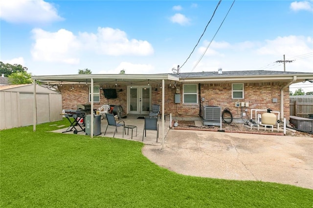 6200 Leslie St, Metairie, LA 70003 - back of property with a patio area, brick siding, central AC unit, and french doors