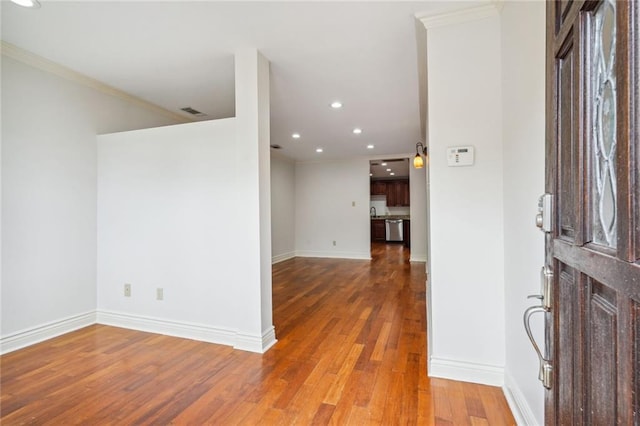 4232 Cadiz St, New Orleans, LA 70125 - foyer entrance featuring wood finished floors, recessed lighting, and crown molding