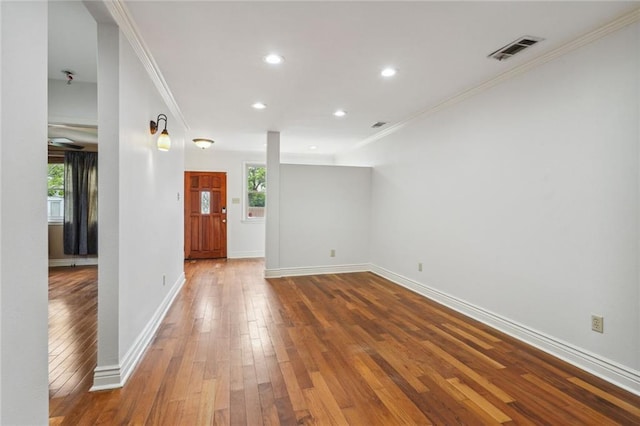 4232 Cadiz St, New Orleans, LA 70125 - unfurnished room featuring crown molding, hardwood / wood-style floors, and recessed lighting