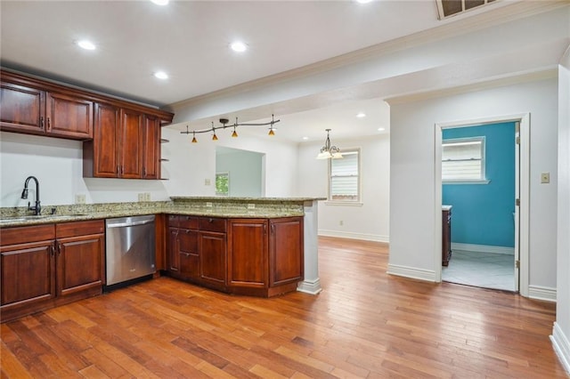 4232 Cadiz St, New Orleans, LA 70125 - kitchen with dishwasher, a peninsula, ornamental molding, light wood finished floors, and light stone countertops