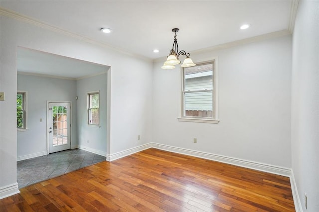 4232 Cadiz St, New Orleans, LA 70125 - empty room featuring wood-type flooring, ornamental molding, a chandelier, and recessed lighting