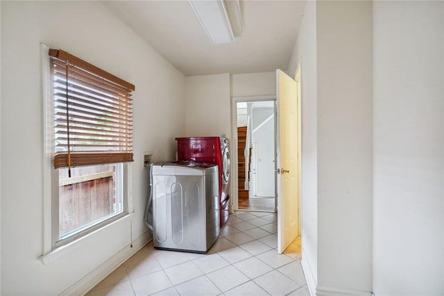 4232 Cadiz St, New Orleans, LA 70125 - laundry room with light tile patterned floors and independent washer and dryer