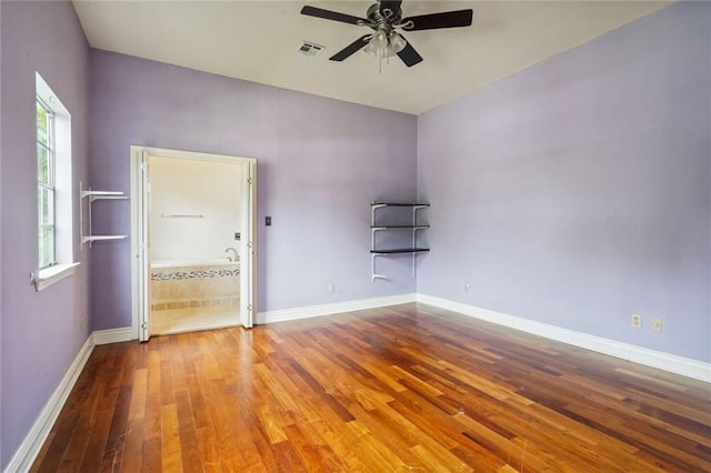 4232 Cadiz St, New Orleans, LA 70125 - unfurnished room featuring wood-type flooring and a ceiling fan